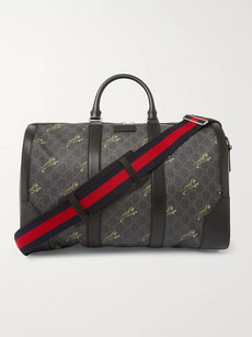 Gucci Leather-trimmed Monogrammed Coated-canvas Holdall In Black