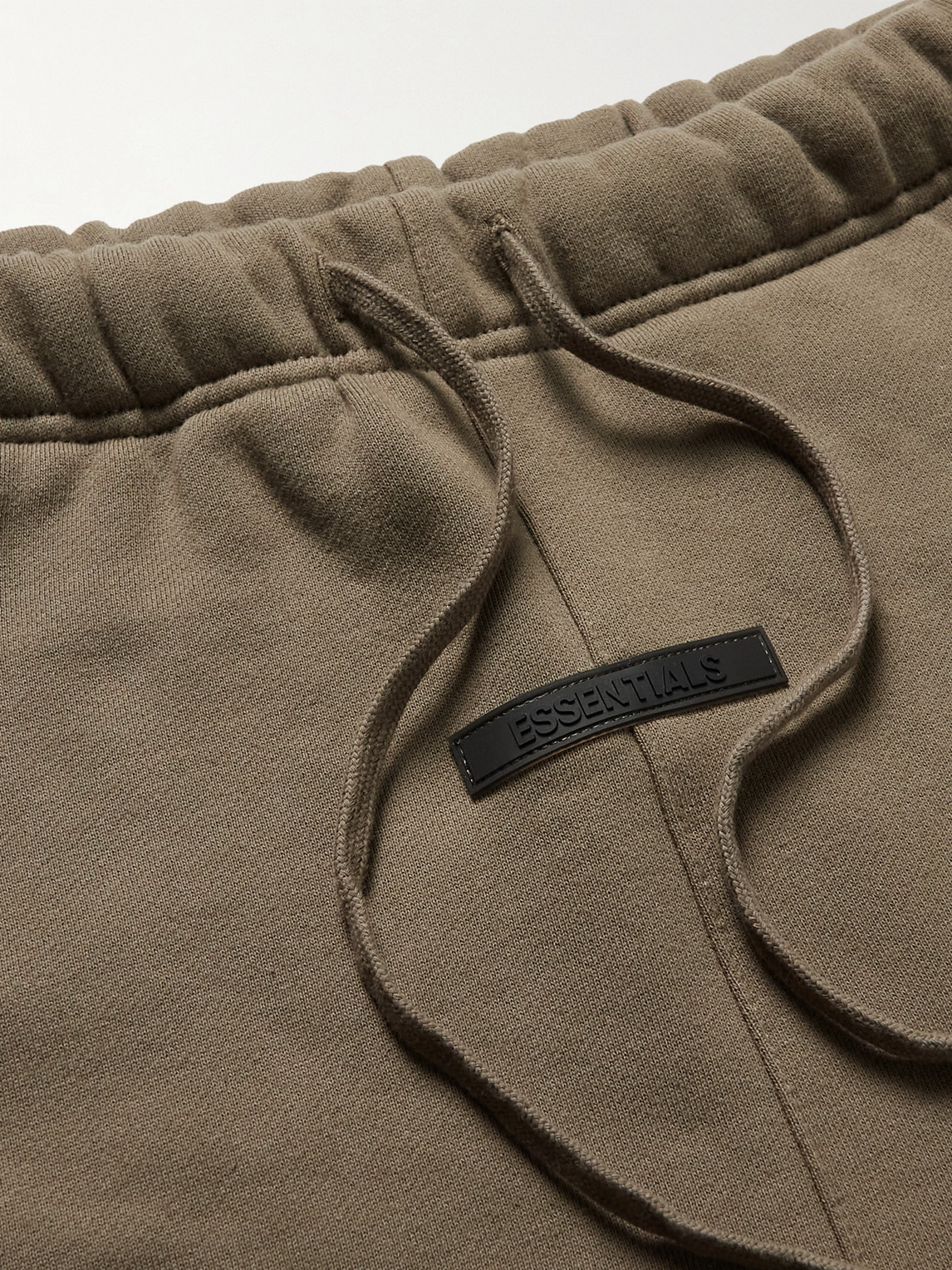 Shop Essentials Tapered Logo-print Cotton-blend Jersey Sweatpants In Brown
