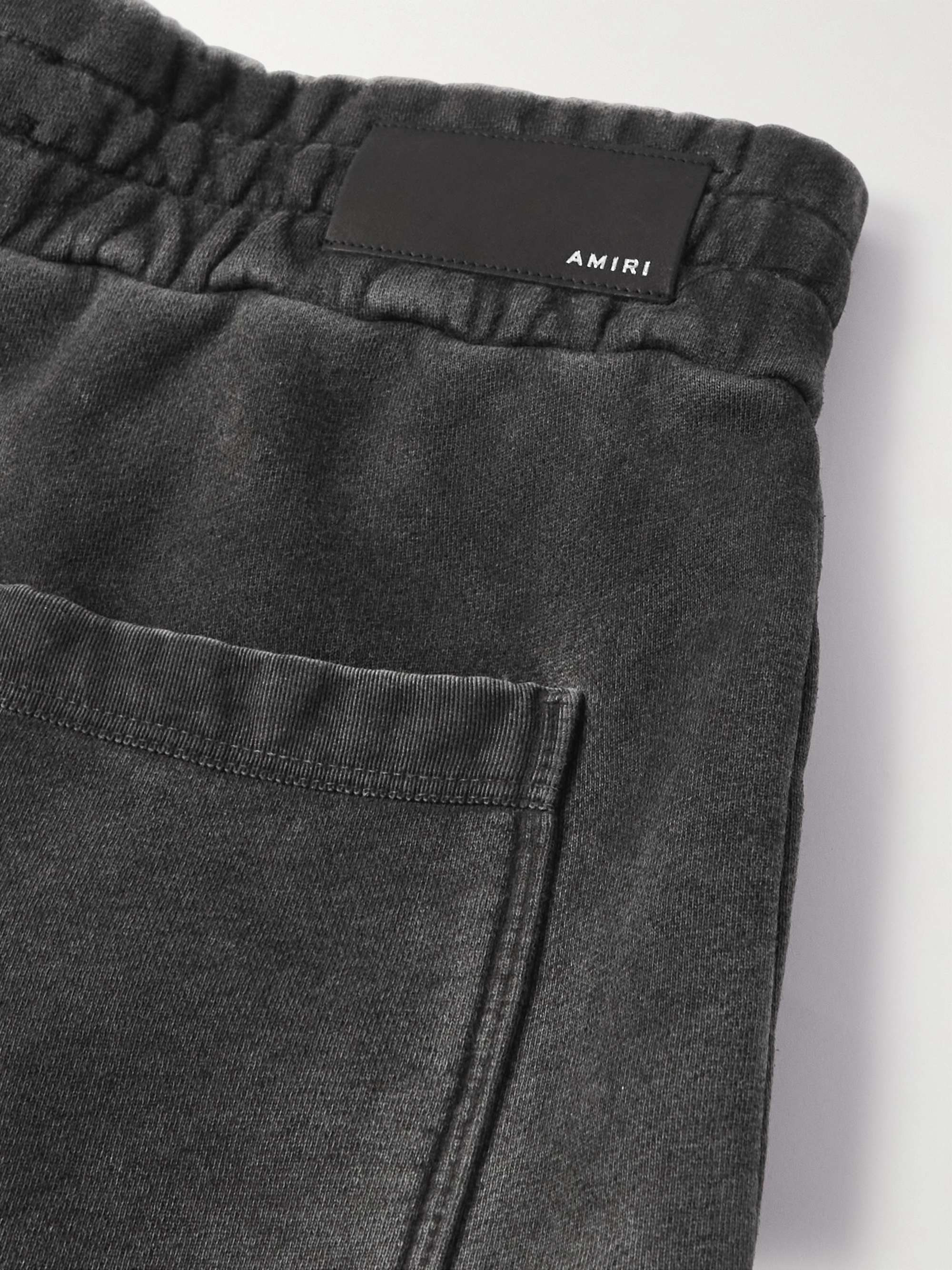 AMIRI Pigment Spray Star Tapered Leather-Trimmed Cotton-Jersey Sweatpants