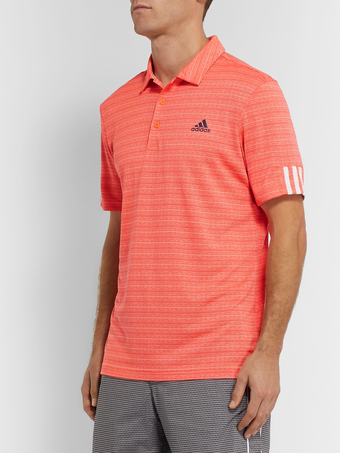 Shop Adidas Golf Striped Tech-jersey Golf Polo Shirt In Orange