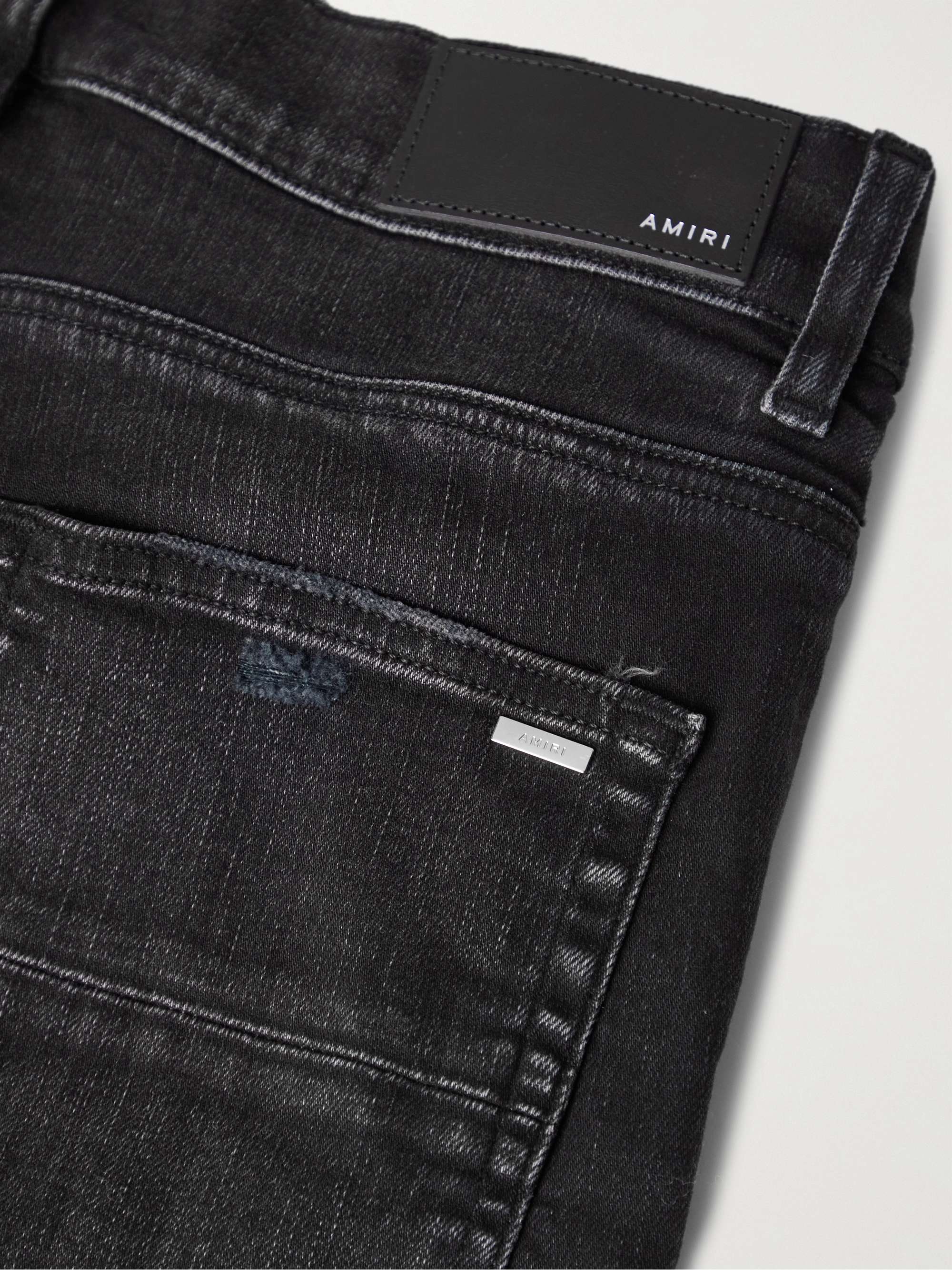 AMIRI Skinny-Fit Logo-Embroidered Distressed Jeans