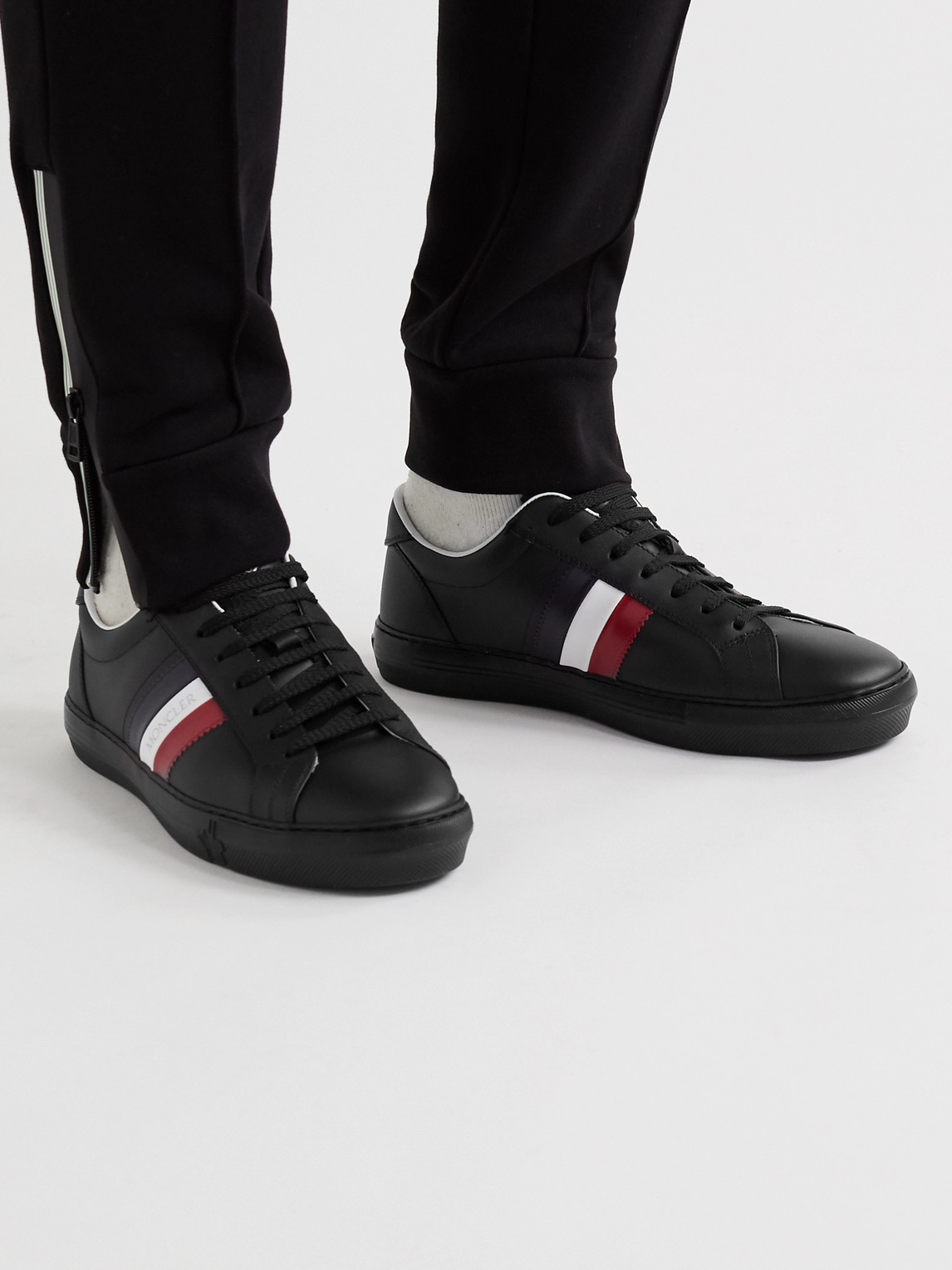 Shop Moncler New Monaco Striped Leather Sneakers In Black