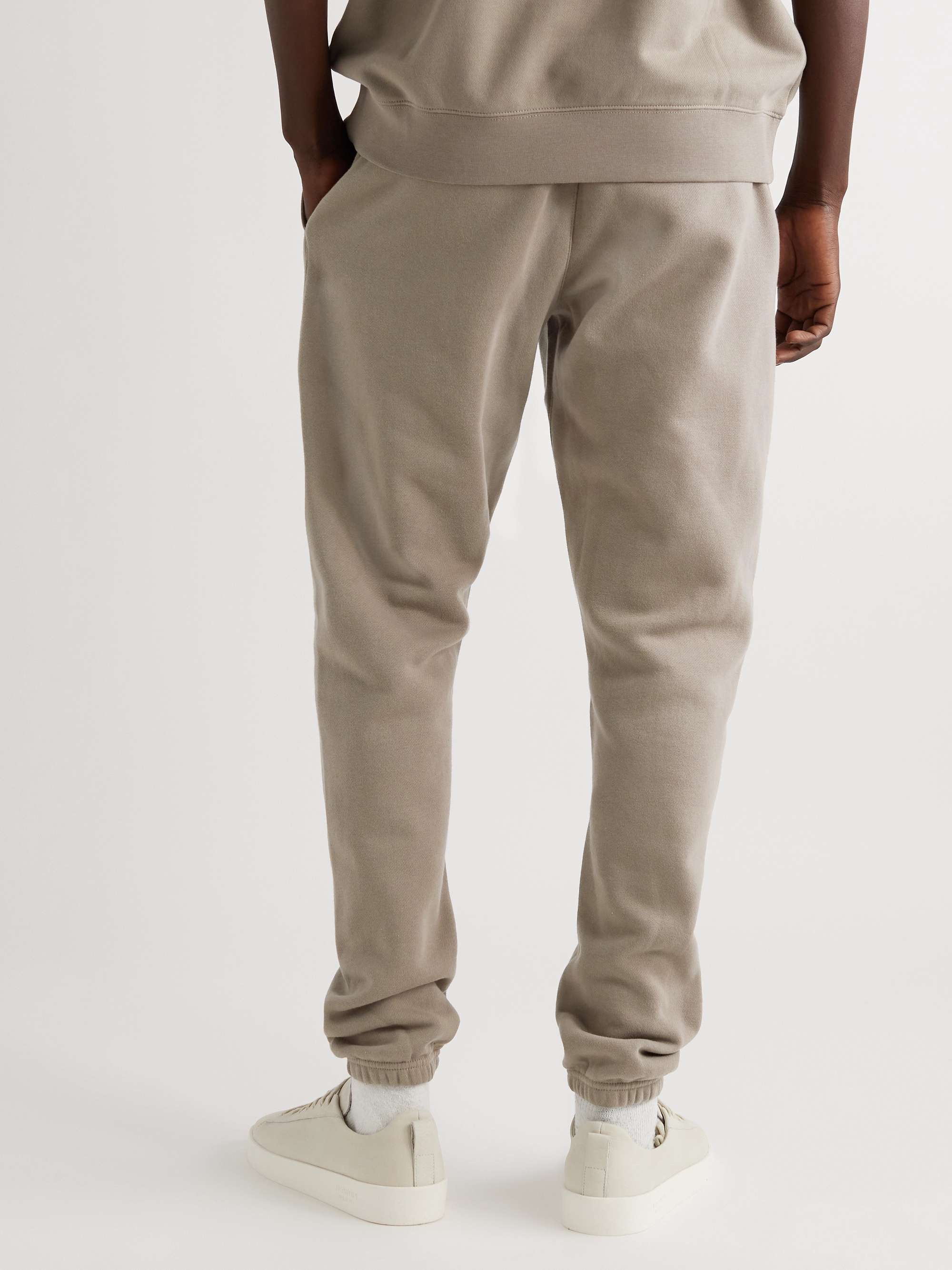 FEAR OF GOD ESSENTIALS Slim-Fit Tapered Logo-Flocked Cotton-Blend Jersey Sweatpants