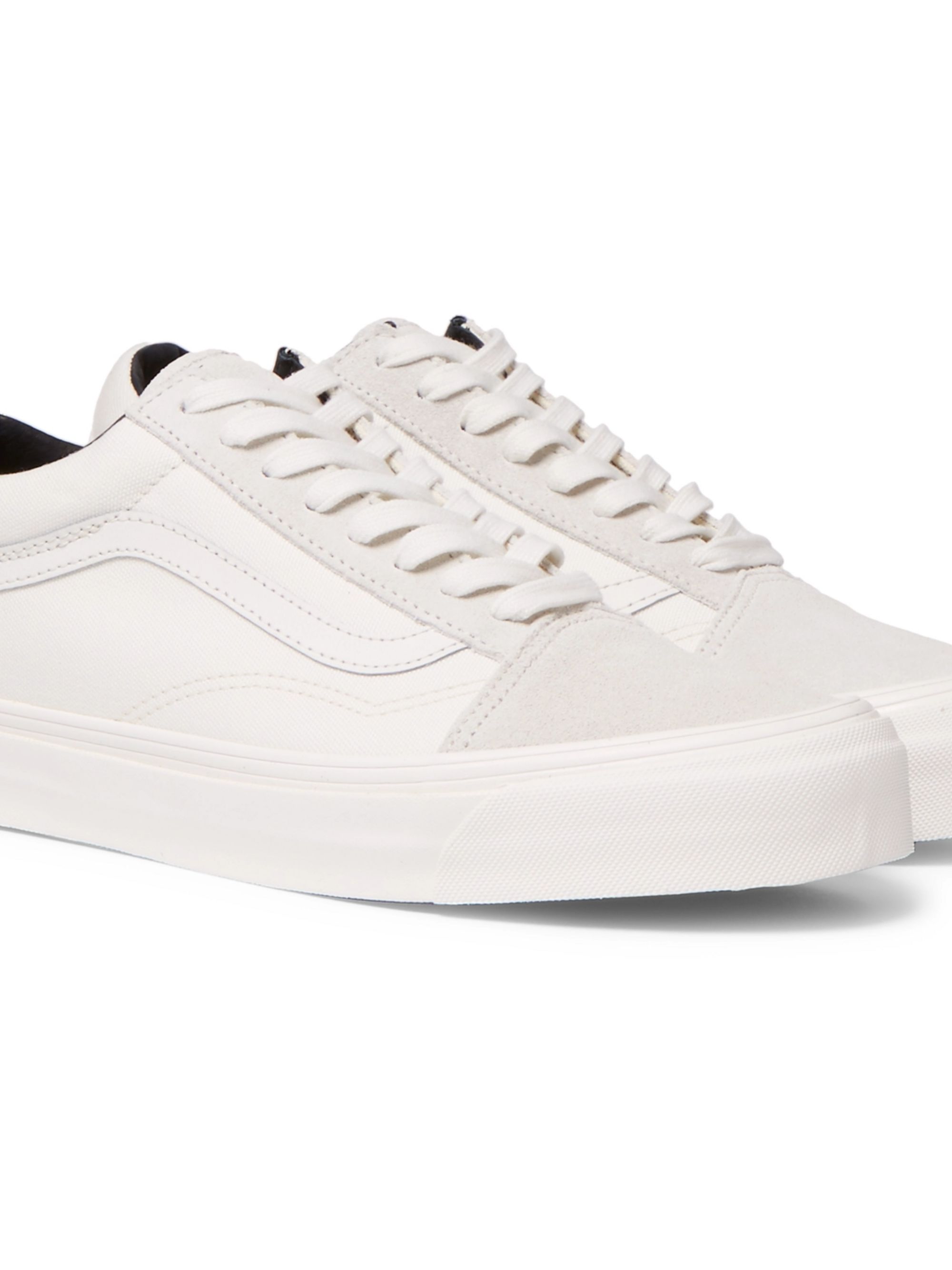 white leather vans with black stripe