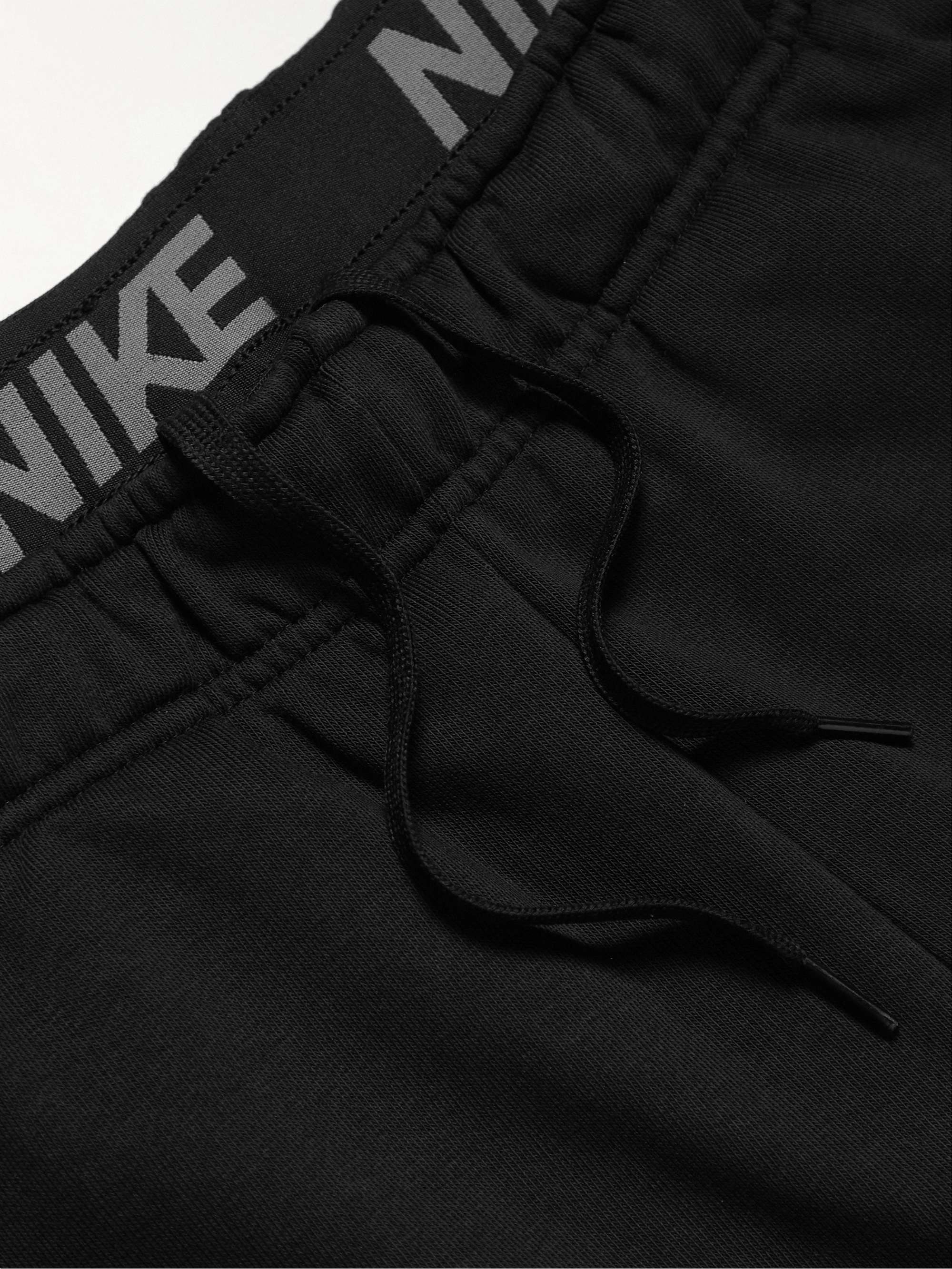 NIKE TRAINING Slim-Fit Tapered Logo-Print Dri-FIT Sweatpants