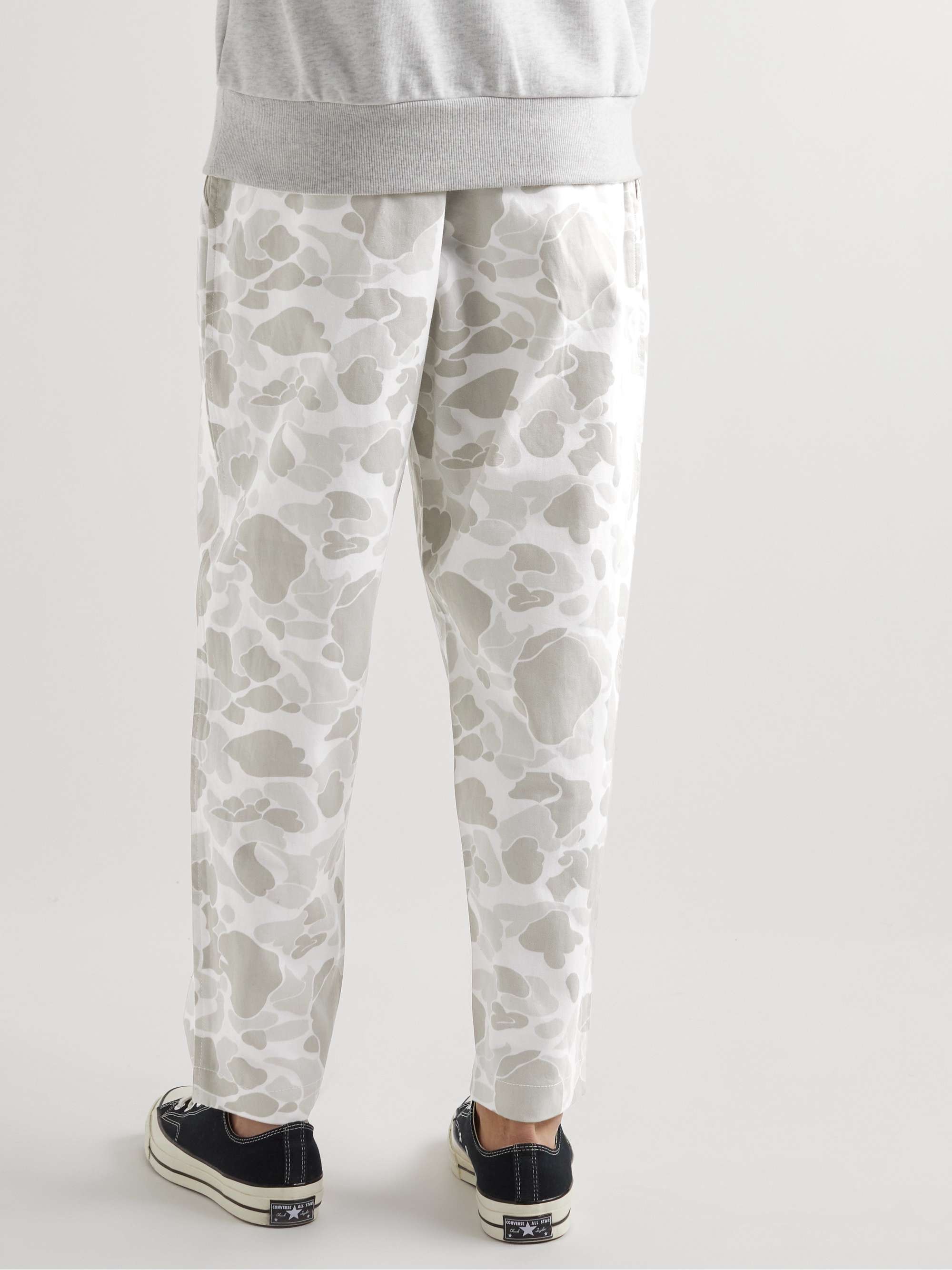UNIVERSAL WORKS Tapered Pleated Camouflage-Print Cotton-Twill Trousers