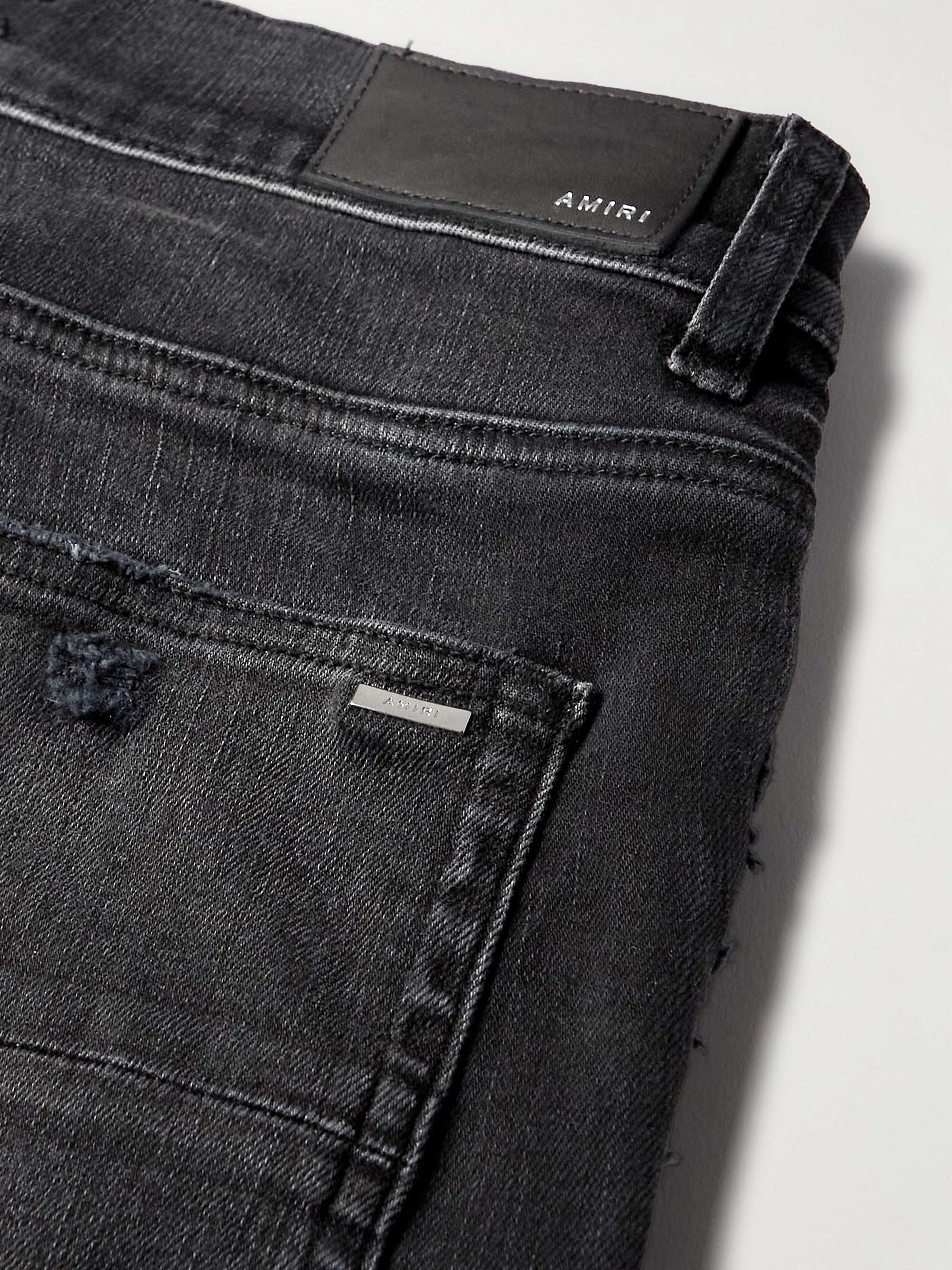 AMIRI Skinny-Fit Logo-Print Distressed Jeans