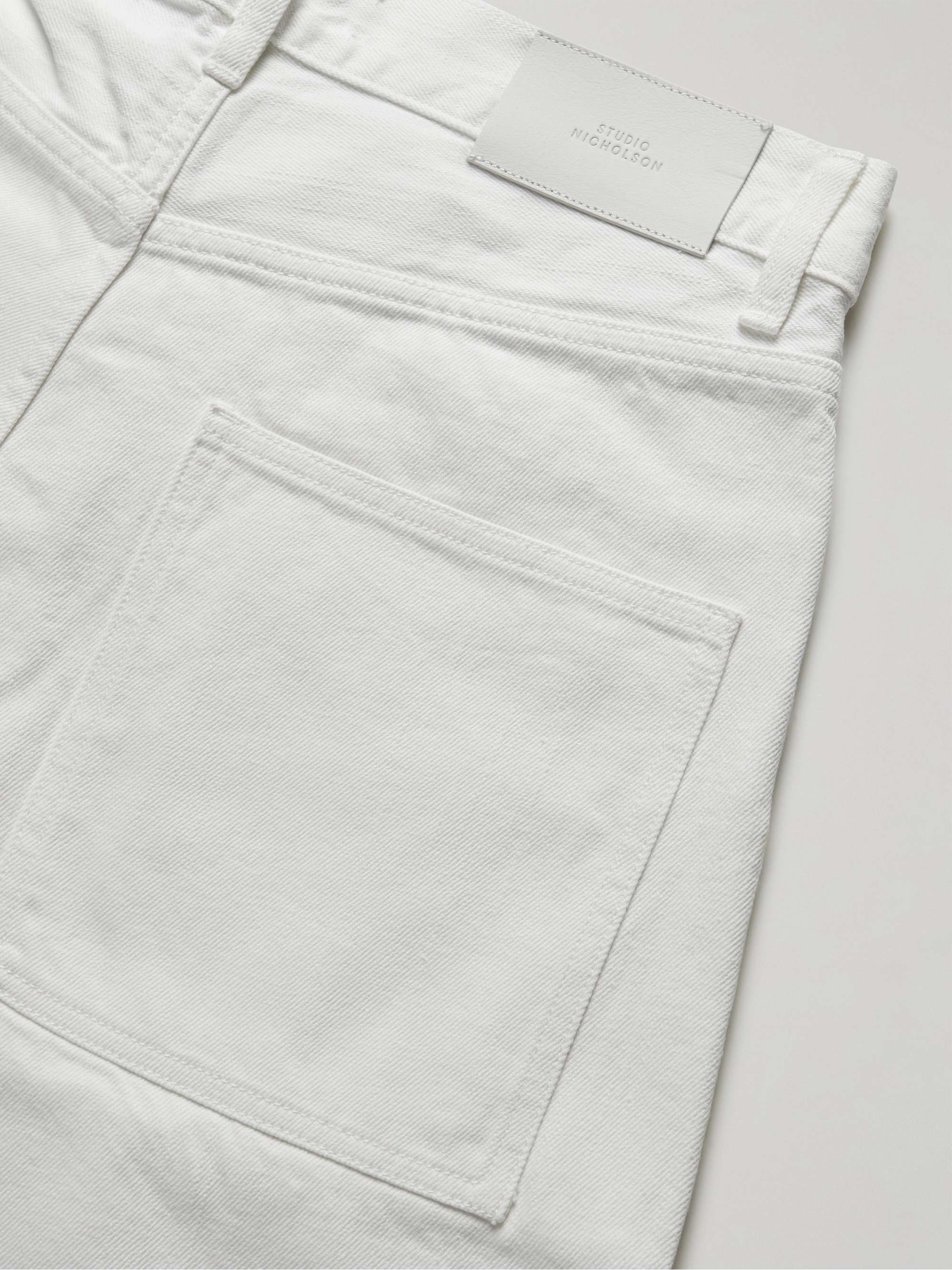 Mens Clothing Jeans Tapered jeans Studio Nicholson Denim Tannaro Tapered-leg Jeans in White for Men 