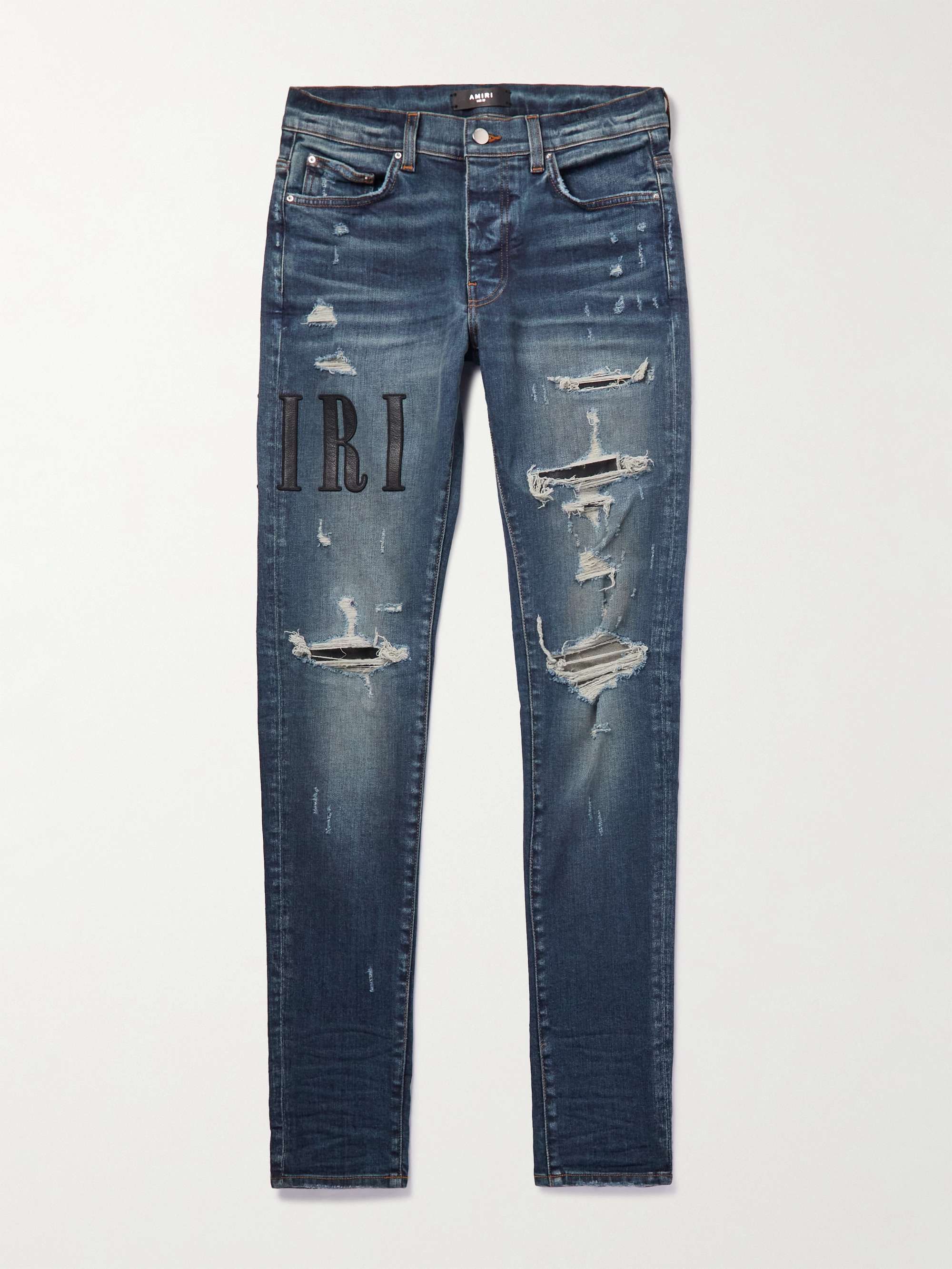 AMIRI Skinny-Fit Leather-Appliquéd Distressed Jeans