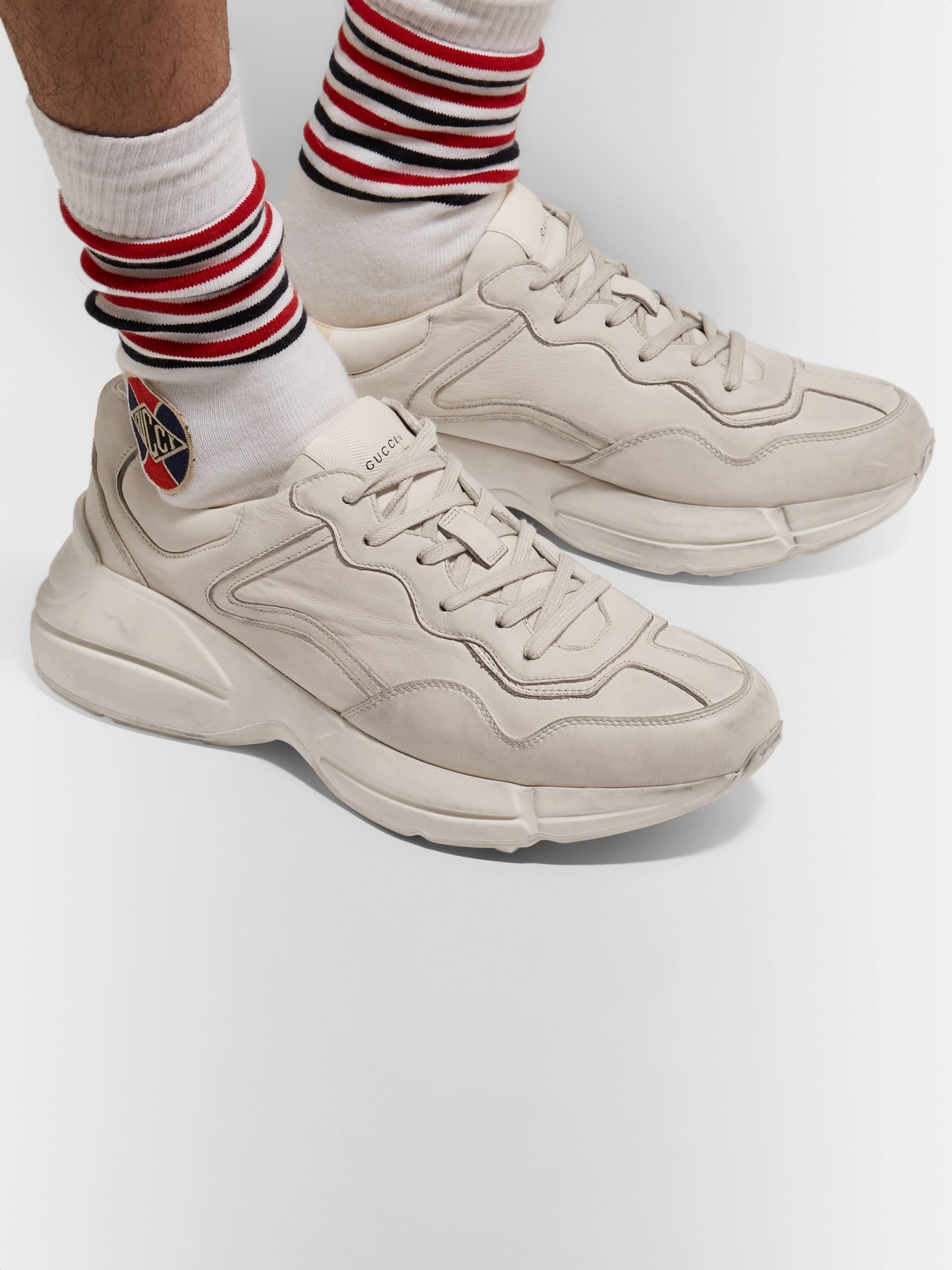 gucci rhyton distressed leather sneakers